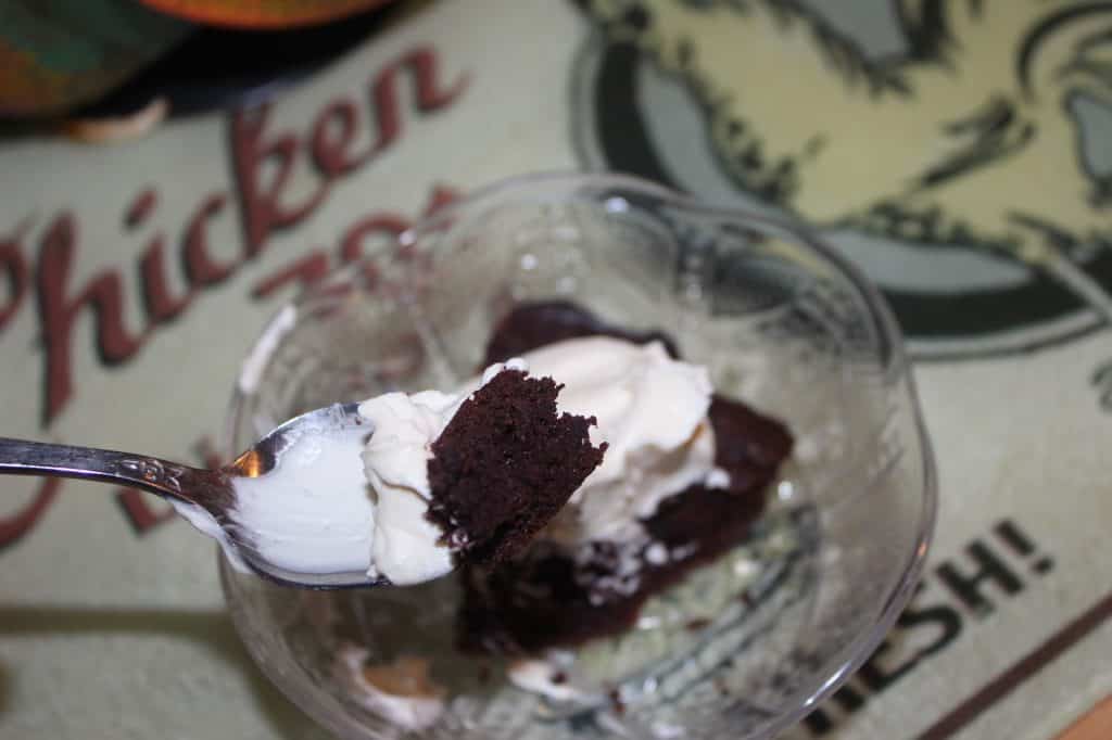 Brownies topped with homemade whipped cream.